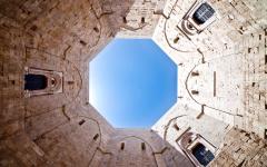 An upward view of the sky from inside the Casta Del Monte in Puglia, Italy 