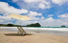 Lounge chairs on the beach in Costa Rica.