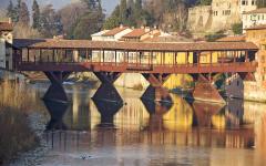 The Ponte Vecchio is a medieval stone bridge over the river Arno.