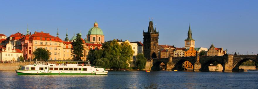 A boat cruises down the River Vlata in Prague.